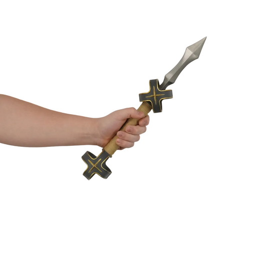 Hand holding a decorative spear with a cross design against a plain background