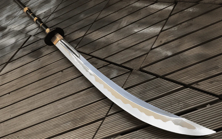 A pronounced curve. Distinct hamon. The kind of blade that commands a room without saying a word.