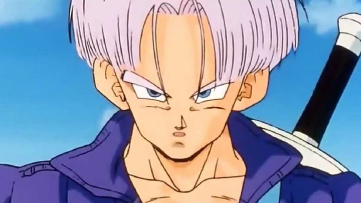 A close-up of Future Trunks with light purple hair and a serious expression, wearing a blue jacket with his sword strapped across his back against a clear sky background.