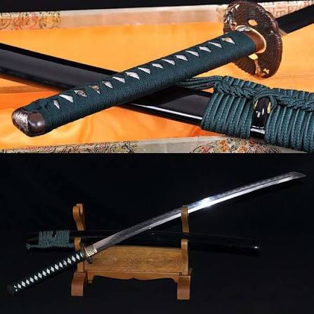 Close-up and full display views of a traditional katana with a black-wrapped handle, ornate guard, polished curved blade, and matching black scabbard.