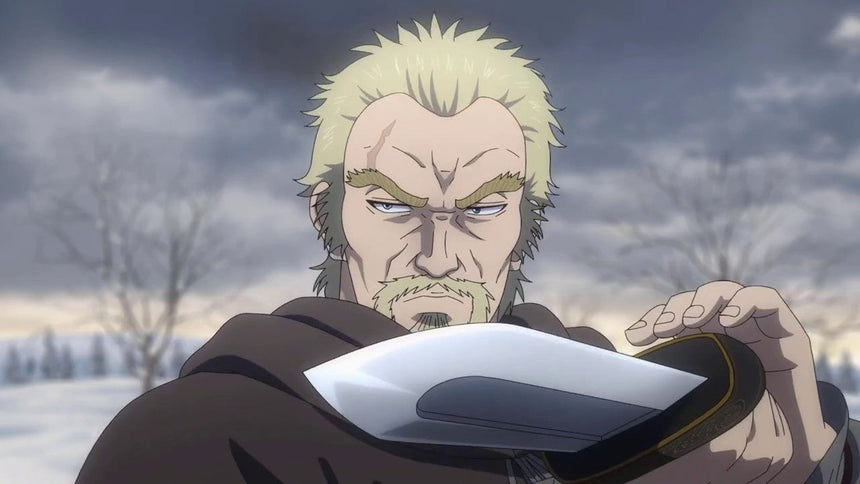 A stern blond warrior grips a short blade close to his face, his intense gaze fixed forward against a cold, snowy backdrop.