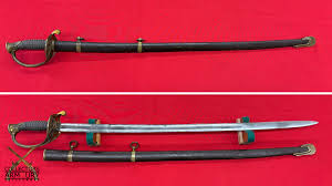 Antique curved saber sword with brass hand guard and black scabbard, shown sheathed on top and unsheathed below against a red background.
