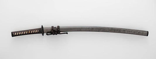 A curved katana with a dark steel blade, black wrapped handle with gold accents, and a tied cord near the guard.