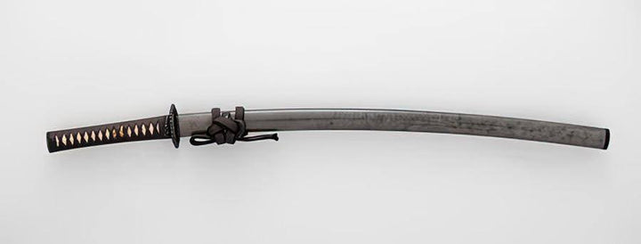 A curved katana with a dark steel blade, black wrapped handle with gold accents, and a tied cord near the guard.
