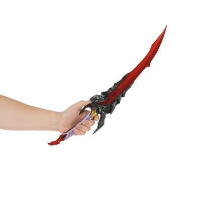 Hand holding a red and black fantasy sword against a white background