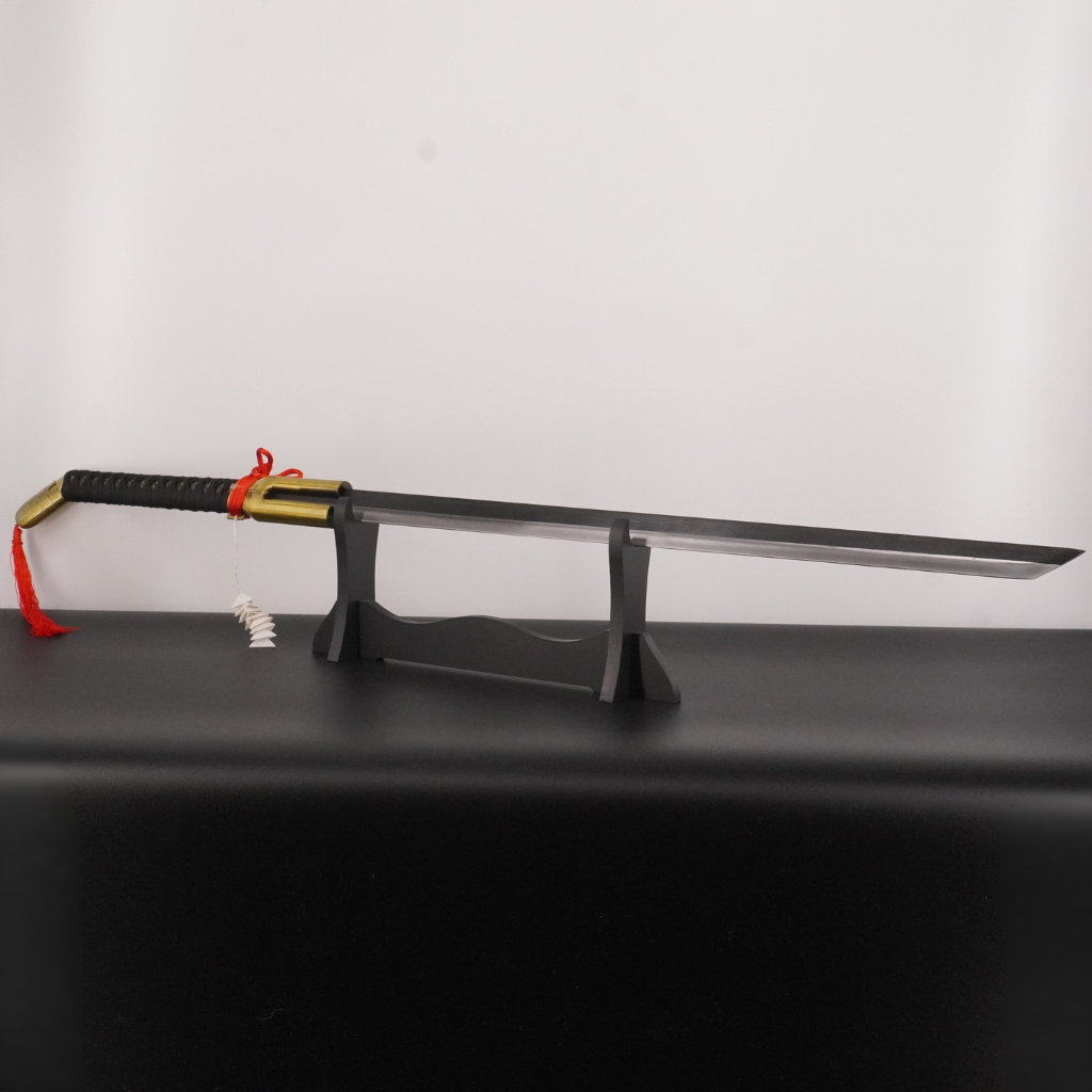 Sword with a black sheath on a stand against a white background