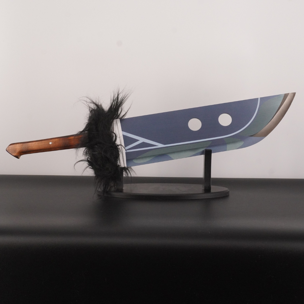 Decorative weapon with a wooden handle and feather on a stand against a plain background