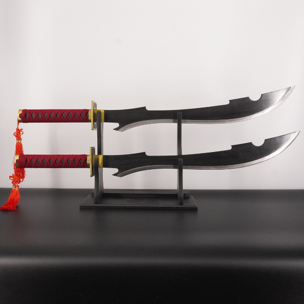 Sword with red handle on a stand against a white background