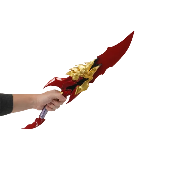 Red and gold fantasy sword held by a person against a white background